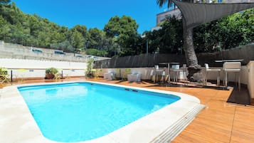 Seasonal outdoor pool, open 10:00 AM to 8:00 PM, pool umbrellas