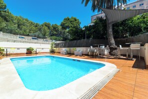 Outdoor pool, open 10:00 AM to 8:00 PM, pool umbrellas, pool loungers