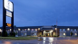 A hotel with a sign for Carrollton Hotel & Event Centre, a steakhouse, and a lounge.