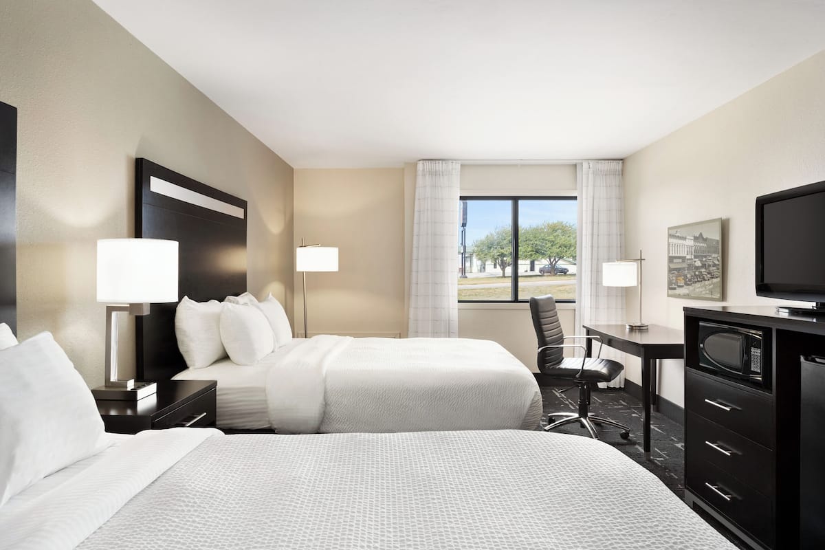 double queen with patio door | down duvets, desk, laptop workspace, iron/ironing board