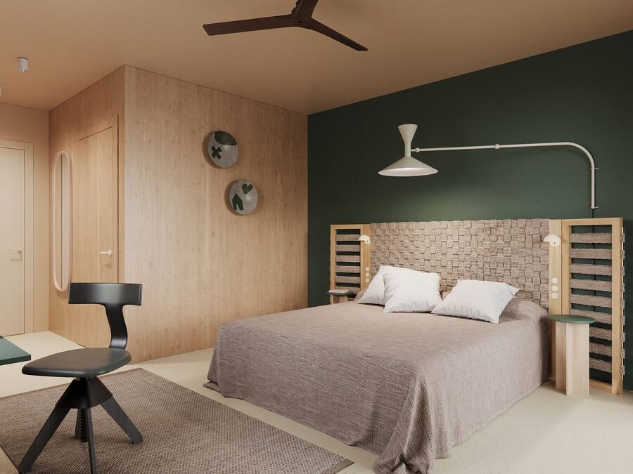 Un dormitorio moderno con una cama, un escritorio y una silla.