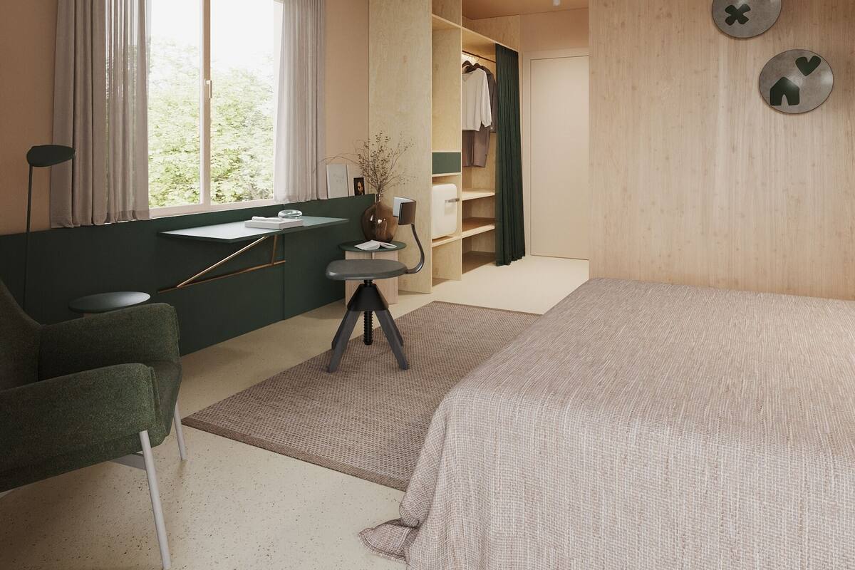 A modern bedroom with a bed, a desk, a chair, a wardrobe, and a ceiling fan.