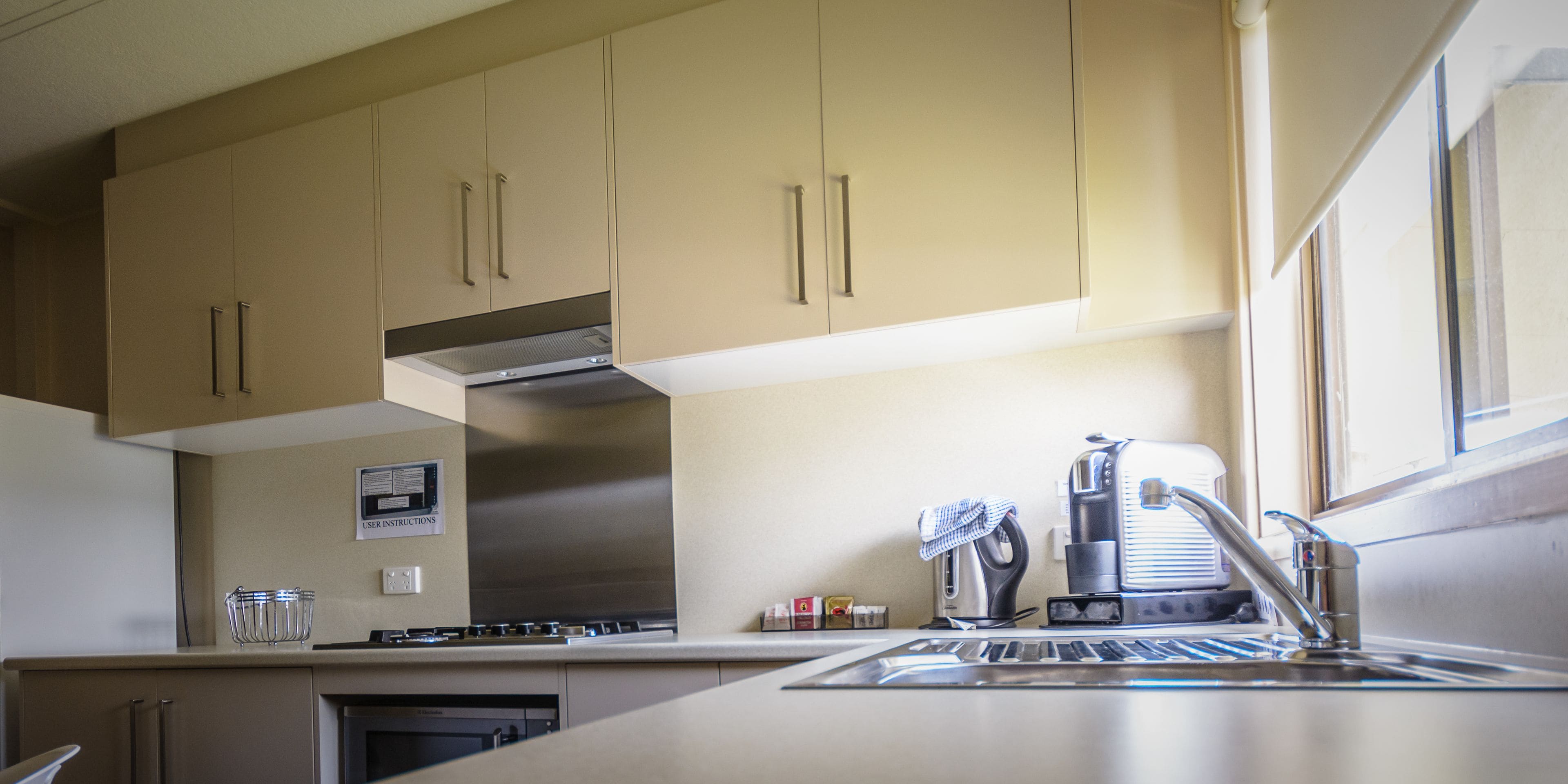 2 bedroom air conditioned cabin | private kitchen | full-sized fridge, microwave, stovetop, coffee/tea maker