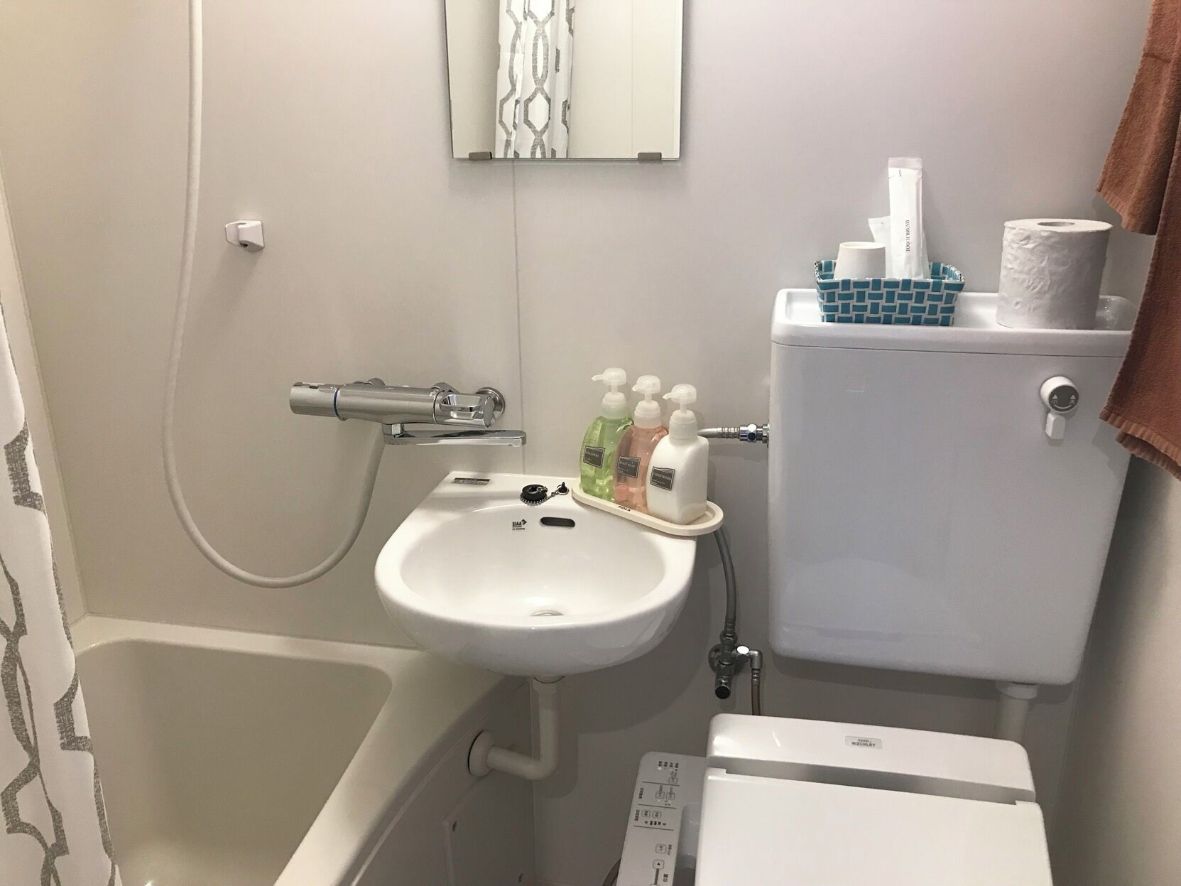 Bathroom | Hair dryer, slippers, electronic bidet, towels