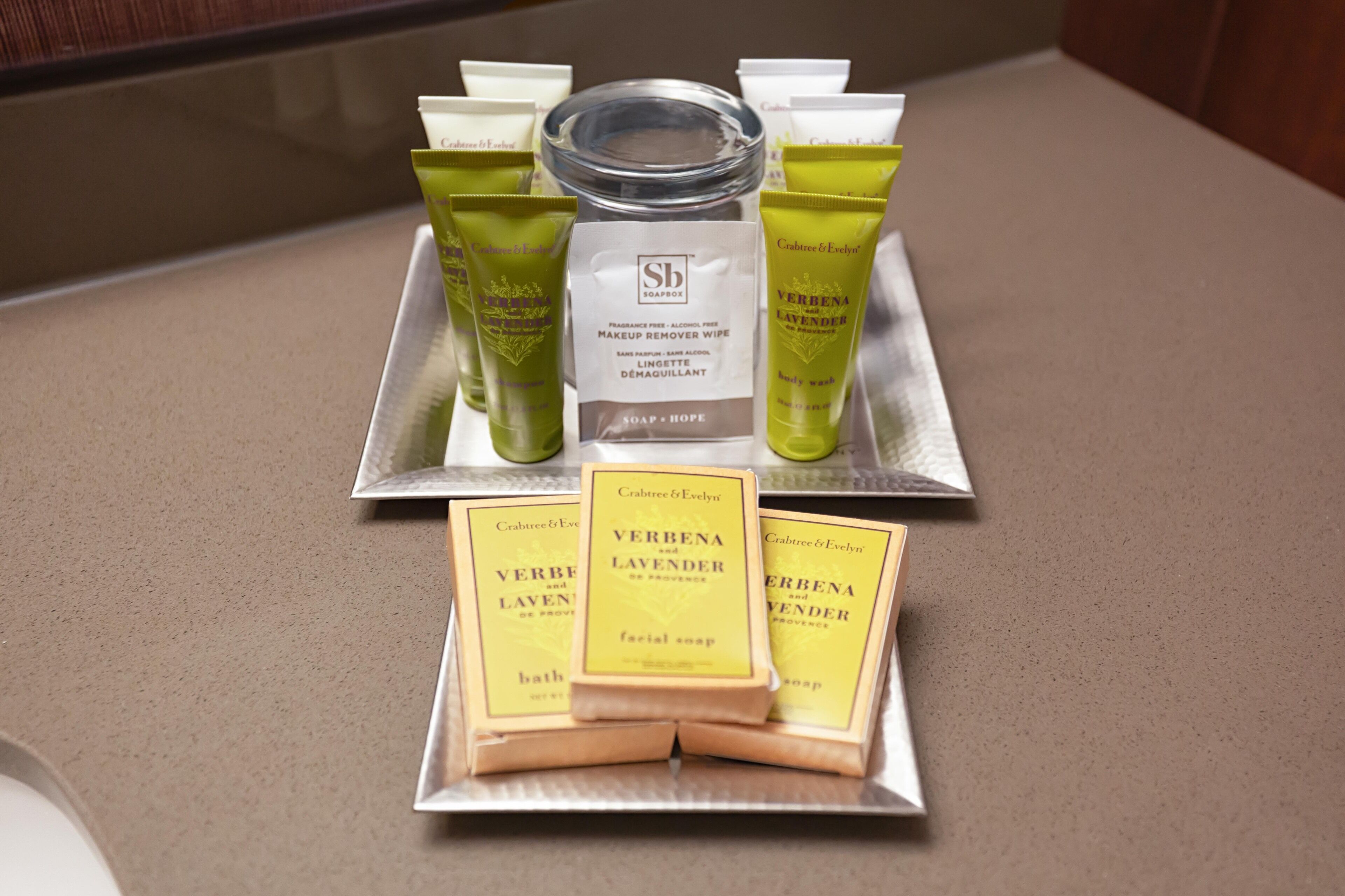 designer toiletries, hair dryer, towels, soap