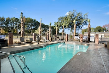 Outdoor pool, open 9:00 AM to 10:00 PM, sun loungers at DoubleTree by Hilton Charleston Mount Pleasant