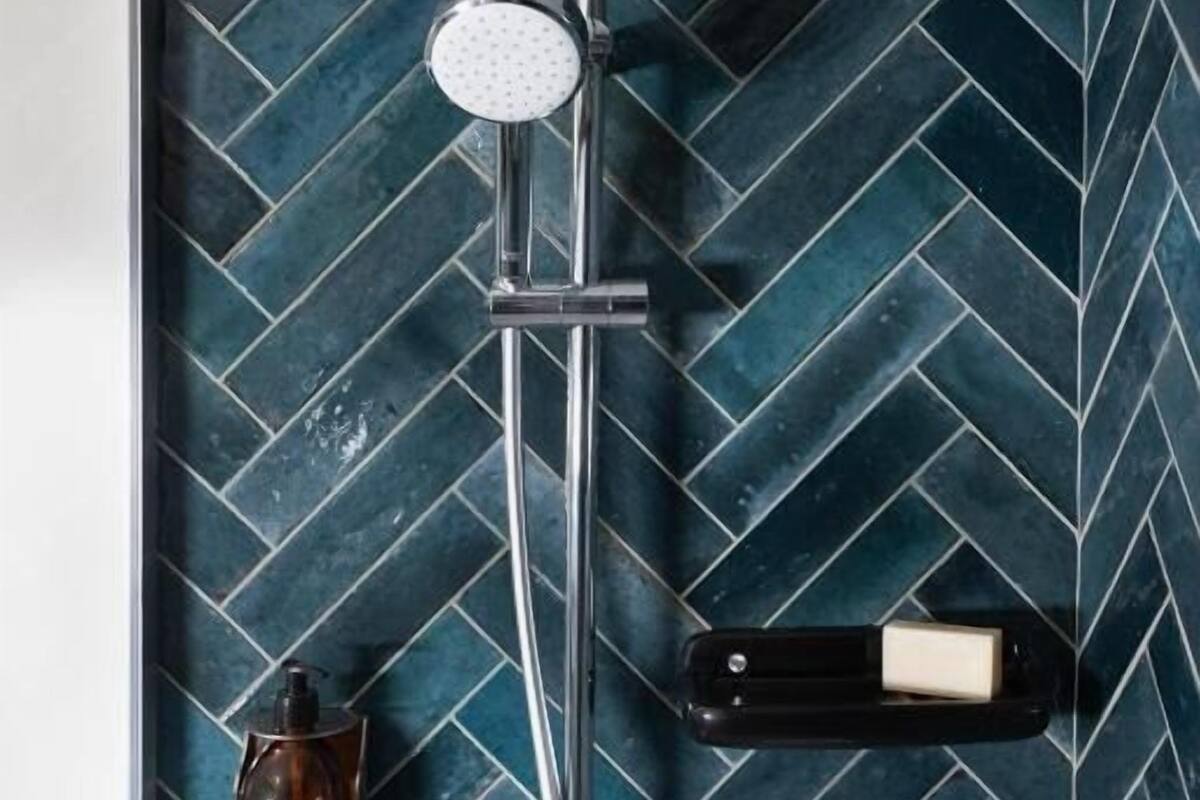 rainfall showerhead, hair dryer, towels, soap