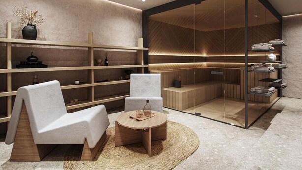A modern spa room with a seating area, shelves with towels, and a wooden bench.