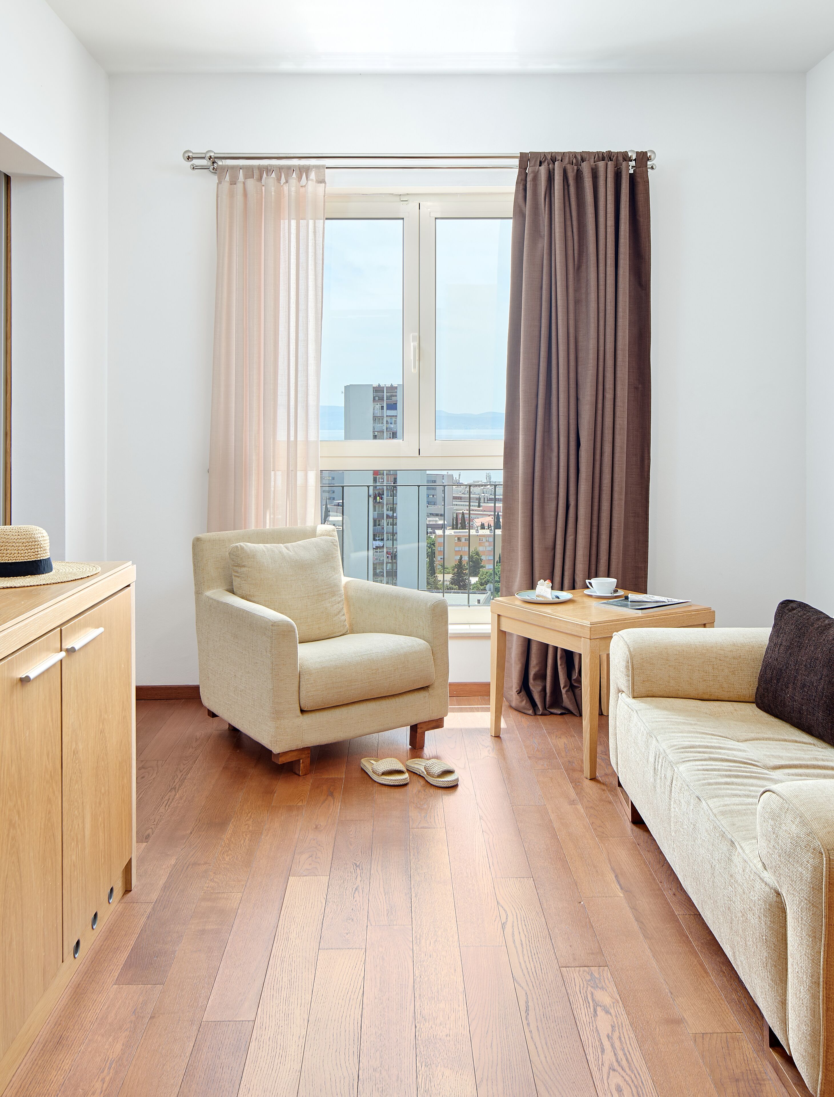 junior suite, balcony, sea view | living area | lcd tv, ipod dock