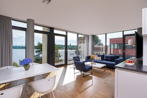 Premium Apartment, Lake View, Corner | Living area | 55-cm flat-screen TV with cable channels, TV