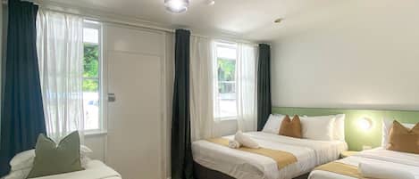 Deluxe Room, Multiple Beds | Desk, free WiFi, bed sheets