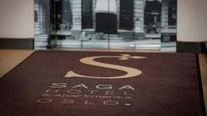 A brown textured surface with the text "Saga Hotel & Apartments Oslo." - Saga Apartments Oslo (Oslo)