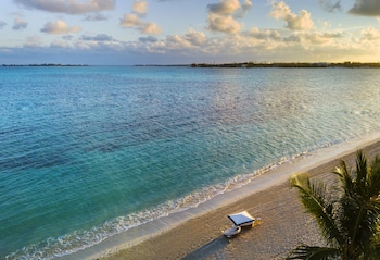 On the beach, white sand, sun loungers, beach umbrellas at Rosewood Baha Mar
