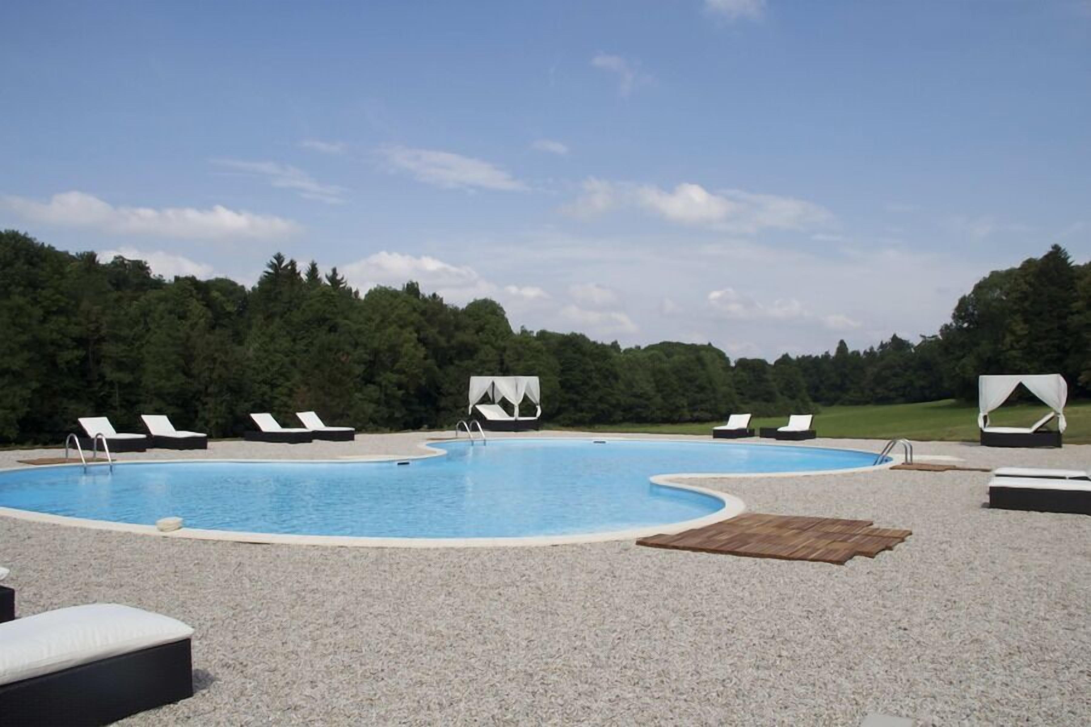 Outdoor pool, open 8:00 AM to 7:00 PM, pool umbrellas, pool loungers