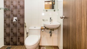 A bathroom with a toilet, sink, and shower. - OYO 431 Hotel De Grand Orchard (Kuala Lumpur)