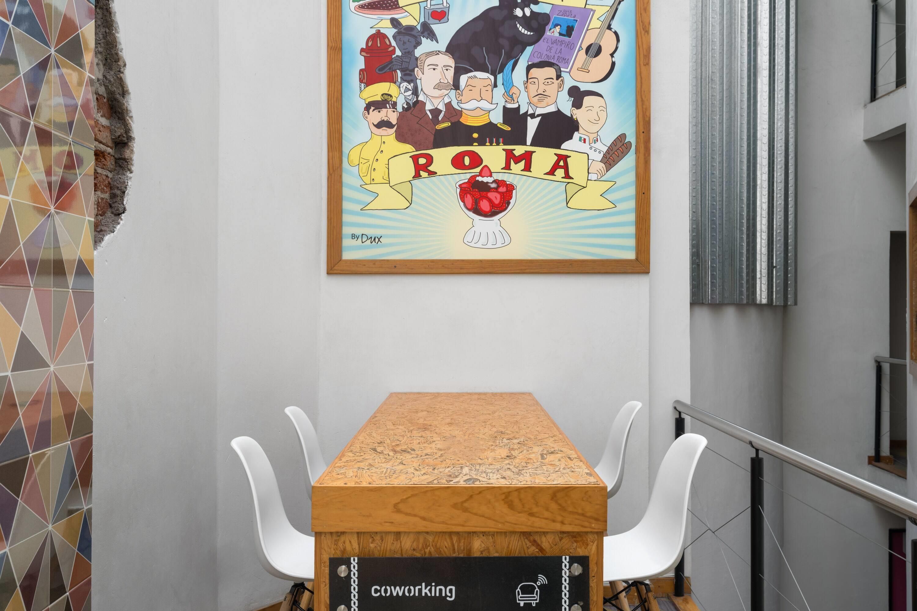 A conference room with a wooden table, white chairs, and a wall-mounted poster of a cartoon.