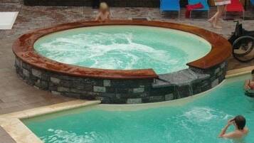 Outdoor pool, open 9:00 AM to 7:00 PM, sun loungers