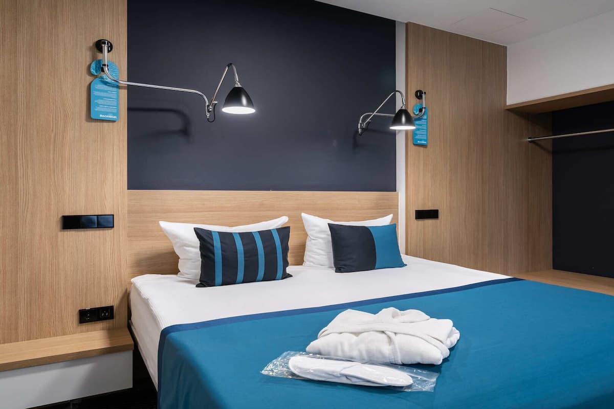 Family Quadruple Room, 1 King Bed with Sofa bed, Non Smoking, Balcony | Premium bedding, minibar, in-room safe, desk