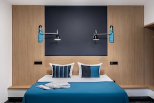 Family Quadruple Room, 1 King Bed with Sofa bed, Non Smoking, Balcony | Premium bedding, minibar, in-room safe, desk