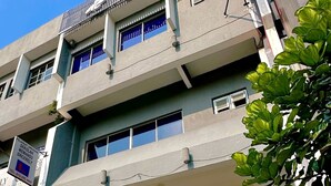 The exterior of the Uptown Hotel with a prominent sign, multiple balconies, and a modern facade. - De UPTOWN Hotel @ Damansara Uptown (Petaling Jaya)