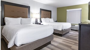 A hotel room with two beds, a desk, a chair, a lamp, and a window. - Holiday Inn Express & Suites Ironton by IHG (Ironton)
