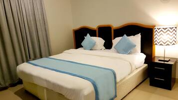 Suite, 1 Bedroom | In-room safe, individually furnished, free cots/infant beds, free WiFi