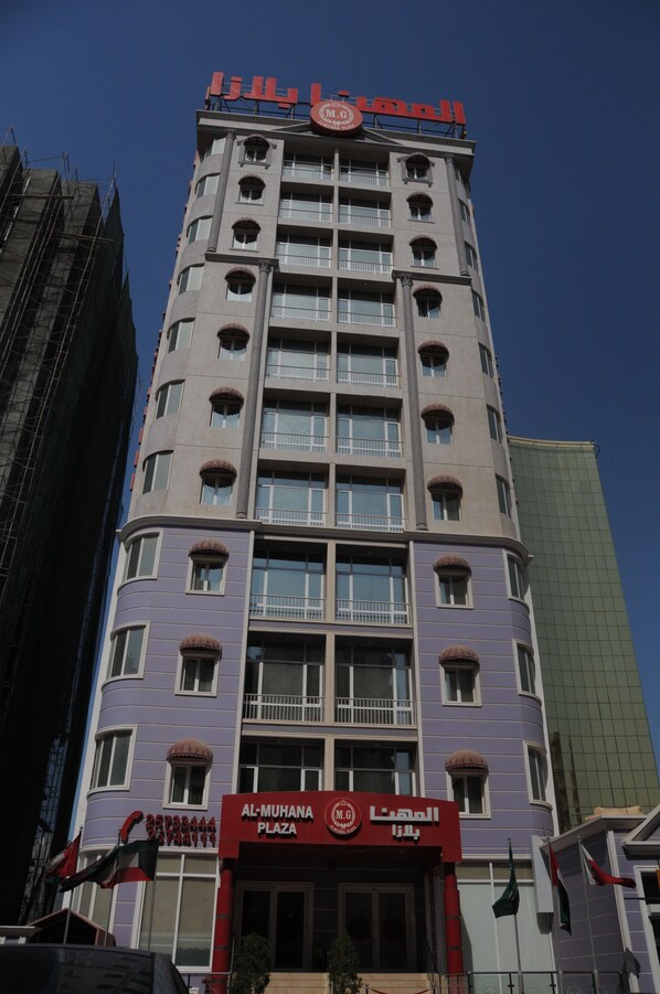 A multi-story building with a prominent sign at the top.