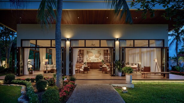 A modern house with a spacious interior, large windows, and a well-lit entrance. - Samanea Beach Resort & Spa (Kep)