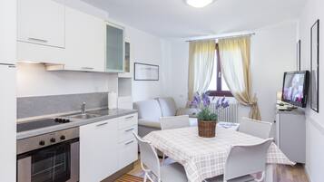 Apartment, 1 Bedroom | Living area | Flat-screen TV