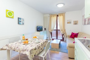 Apartment, 2 Bedrooms | Living area | Flat-screen TV - La Rosa delle Dolomiti (Carisolo)