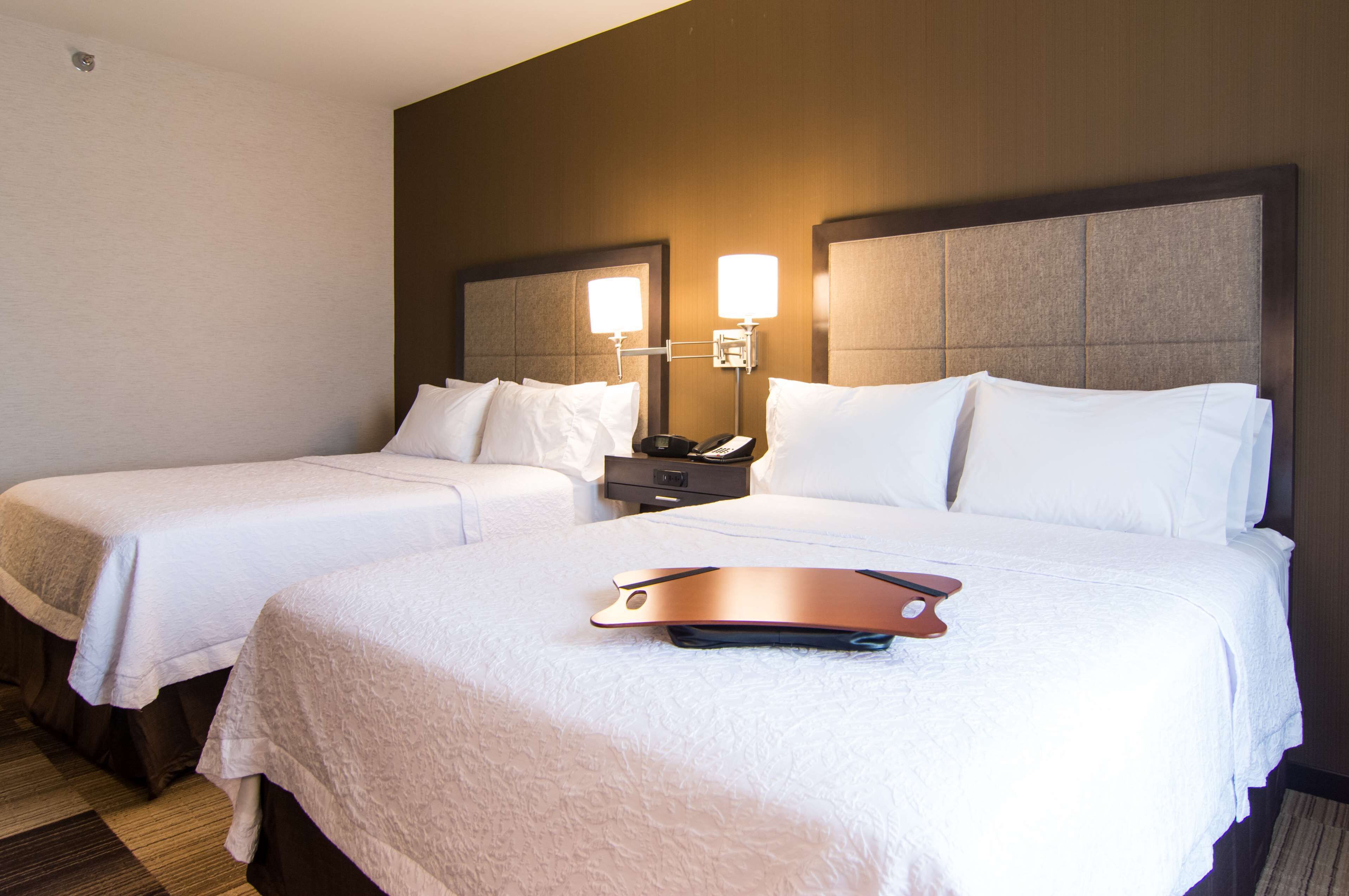 room, 2 queen beds, refrigerator | in-room safe, iron/ironing board, cots/infant beds, wifi