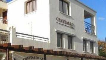 A building with a sign that reads "CRYSTAL AQUARIUM."