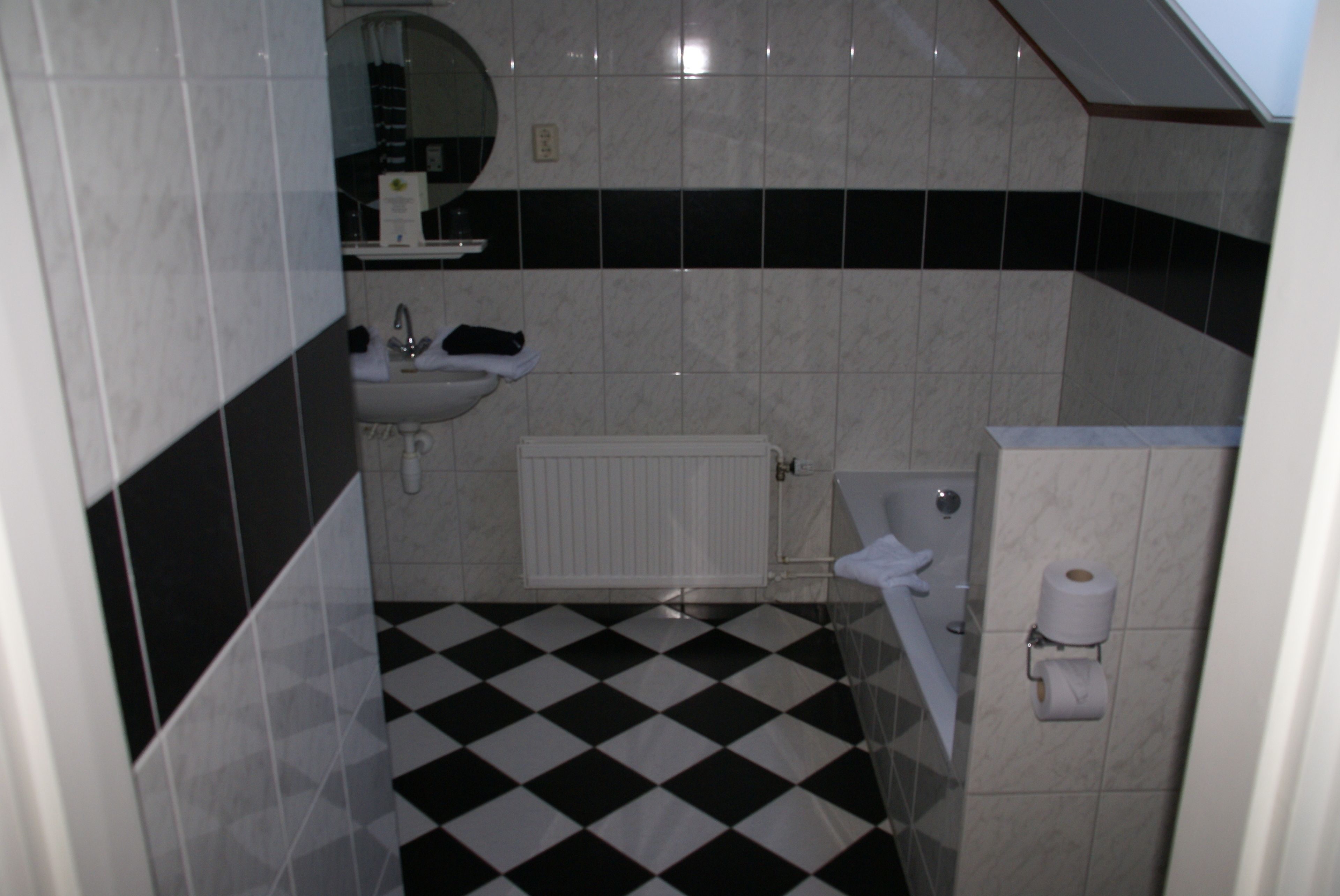 deluxe double room | bathroom | hair dryer, towels