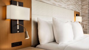 A hotel room with a large bed, two bedside lamps, and a wall-mounted control panel. - Country Inn & Suites by Radisson, Bathinda (Bathinda)