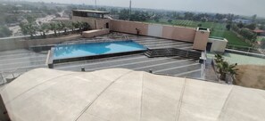 Outdoor pool - Country Inn & Suites by Radisson, Bathinda (Bathinda)