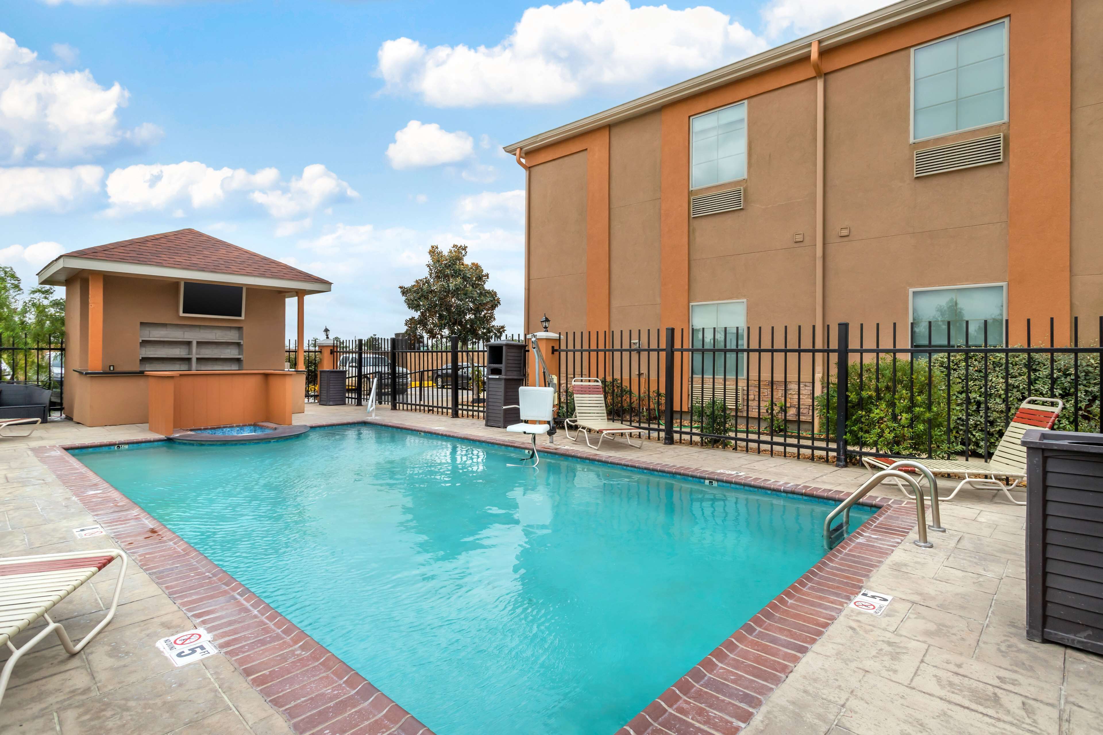 seasonal outdoor pool, open 10 am to 10 pm, pool loungers