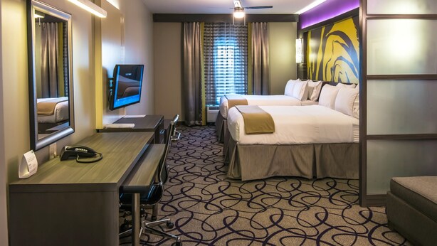 A hotel room with a desk, two beds, a TV, and a large mirror. - Holiday Inn Express & Suites Garland E - Lake Hubbard I30 by IHG (Garland)