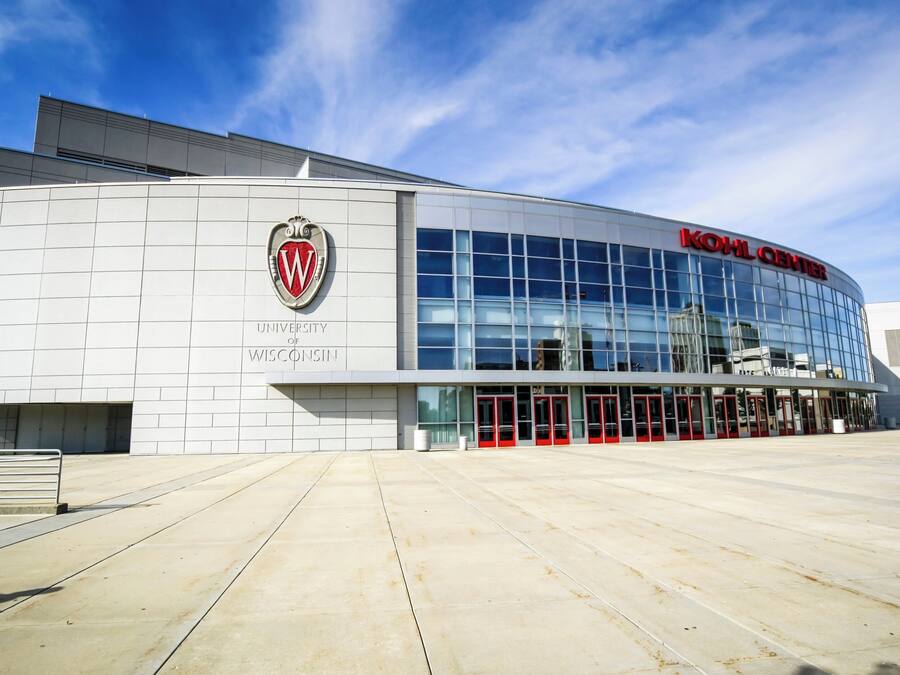 A modern building with a prominent logo and signage for the University of Wisconsin.