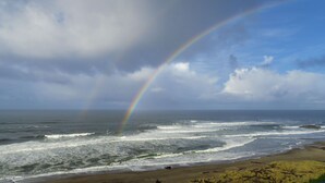 A beach with waves and a rainbow. - Ocean Terrace Condominiums (Lincoln City)