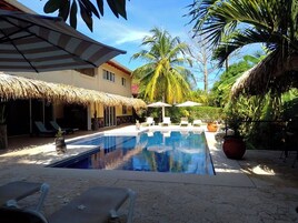 Outdoor pool, pool umbrellas, sun loungers