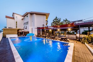 Seasonal outdoor pool, open 9:00 AM to 7:00 PM, pool umbrellas