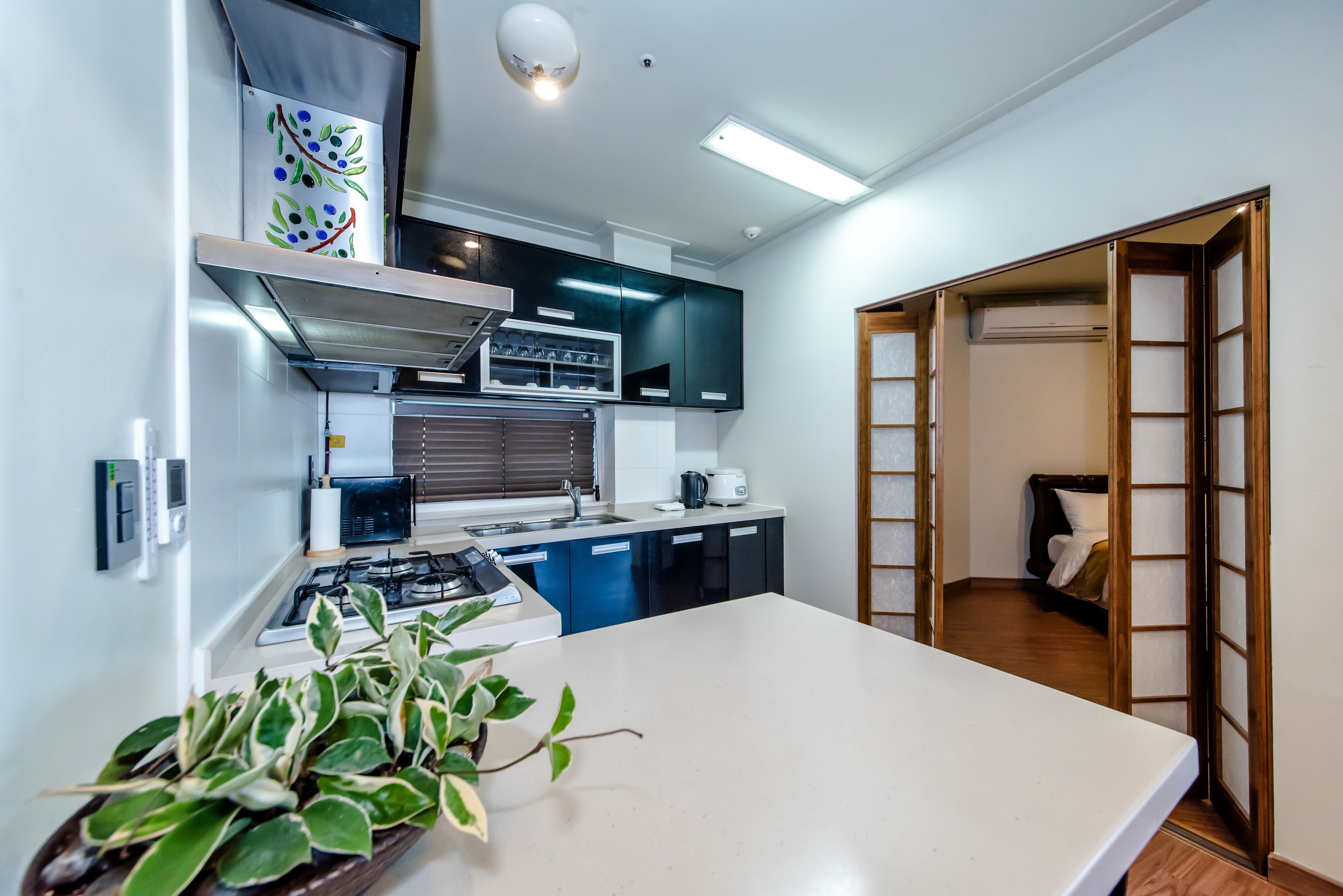 suite, 2 bedrooms, kitchen, ocean view | private kitchenette | fridge, electric kettle, rice cooker, cookware/dishes/utensils