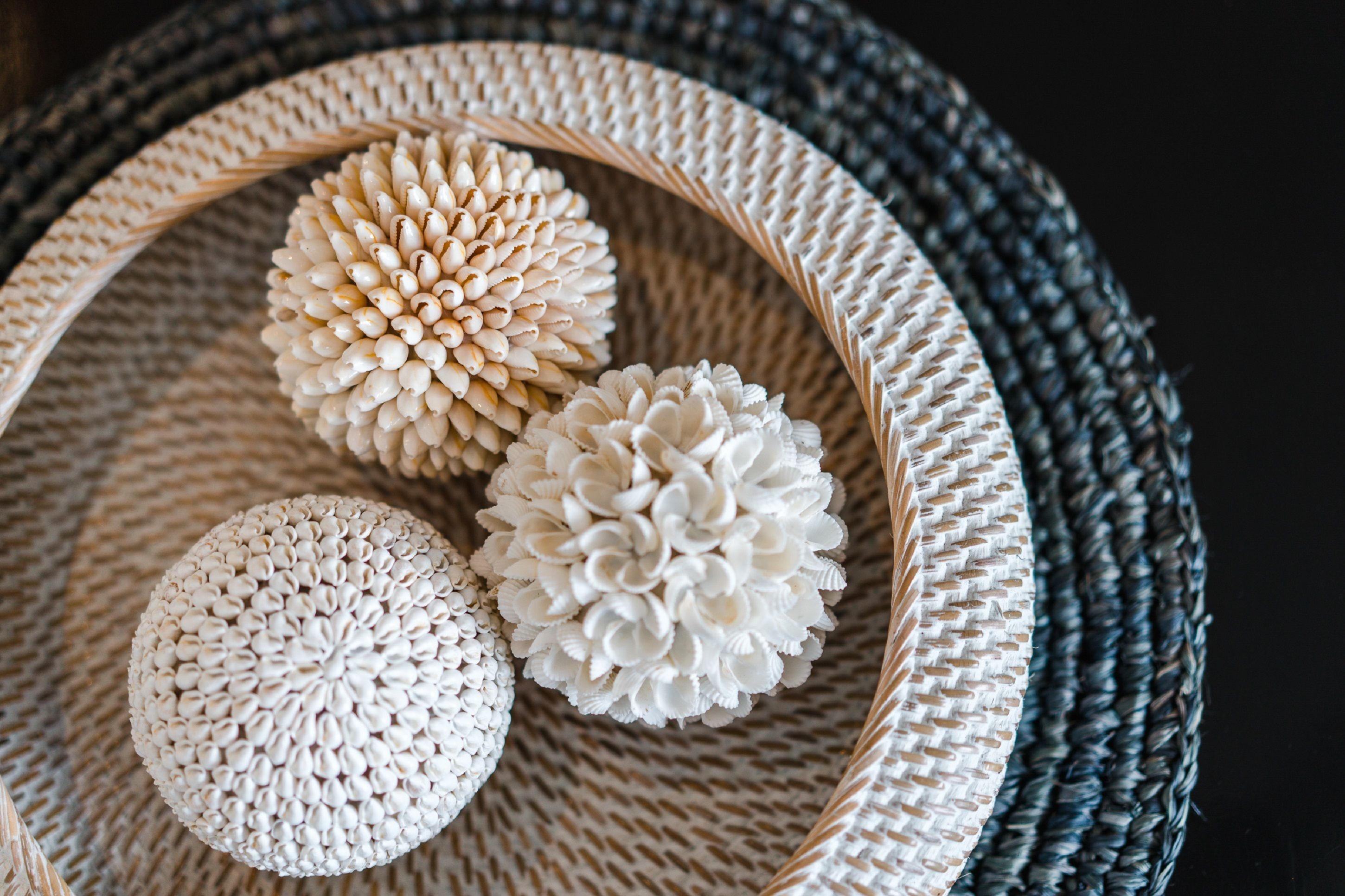 Three spherical objects in a woven basket.
