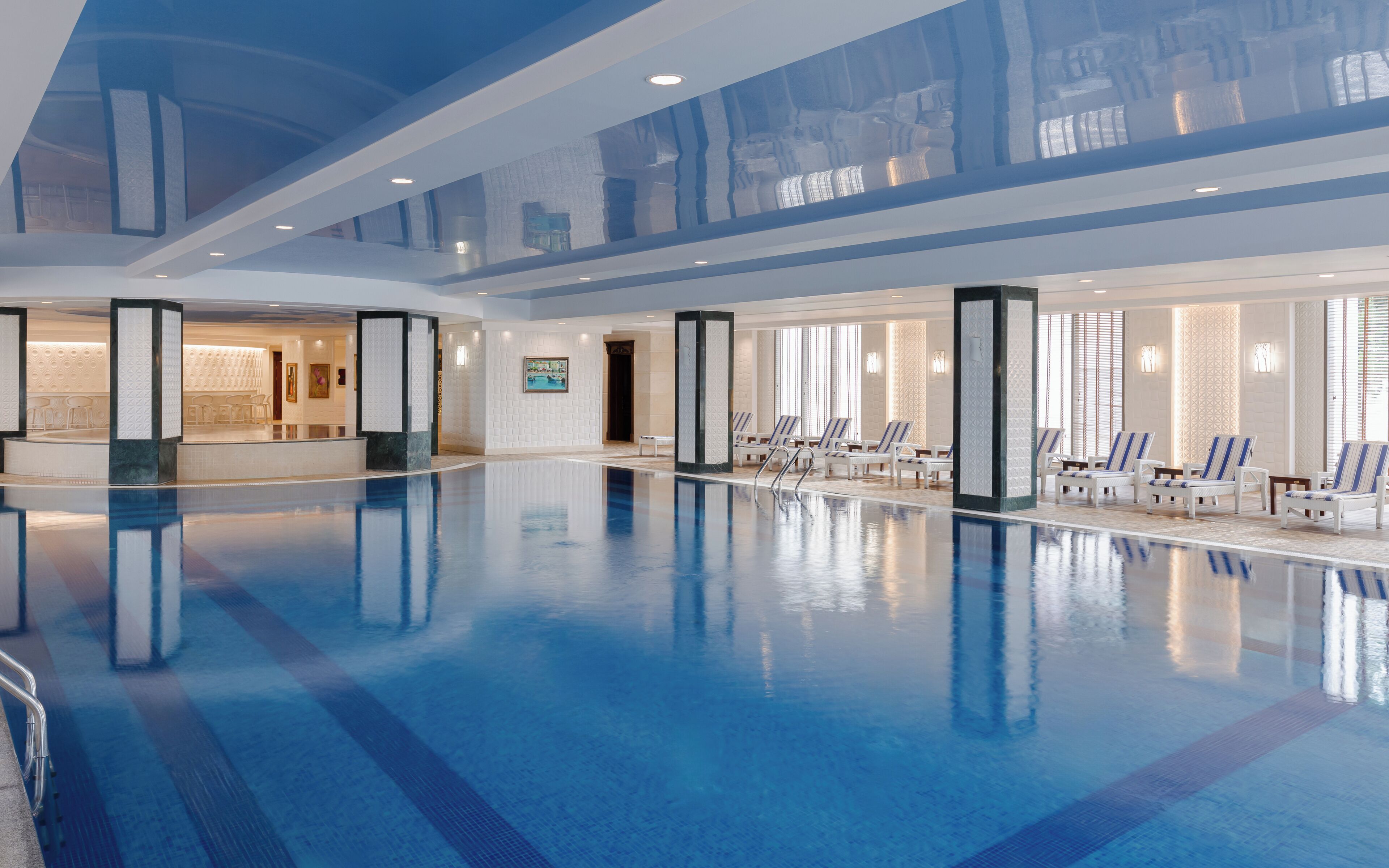 indoor pool, outdoor pool, pool loungers