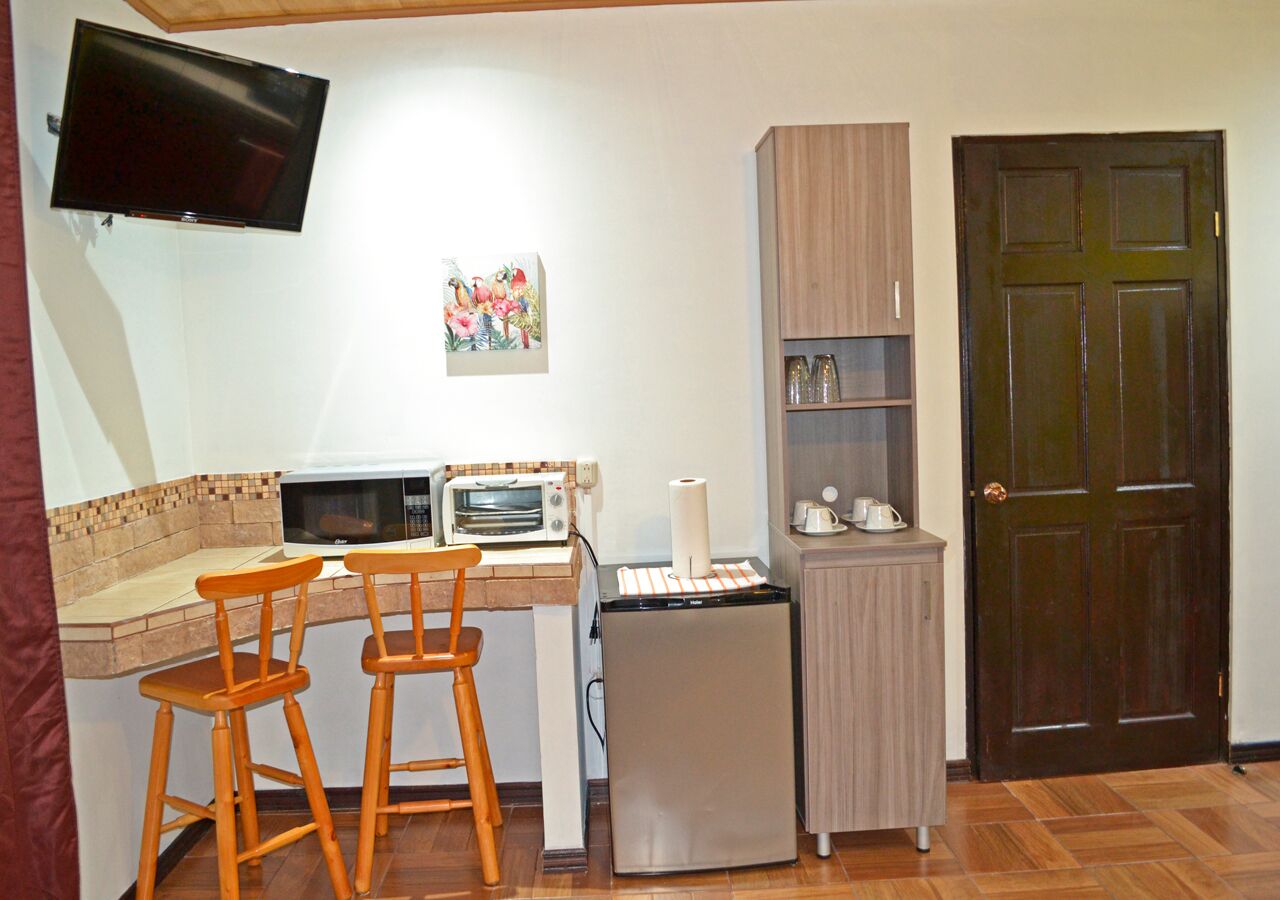studio, 1 bedroom, garden view | private kitchen | mini-fridge, microwave, coffee/tea maker, dining tables