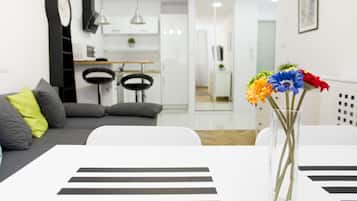 Deluxe Apartment, 1 Bedroom, Balcony | Living room | 40-inch flat-screen TV with cable channels, TV