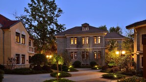 A large, multi-story building with a symmetrical facade, multiple windows, and a central entrance. - Relais & Chateaux Yihe Mansions (Nanjing)