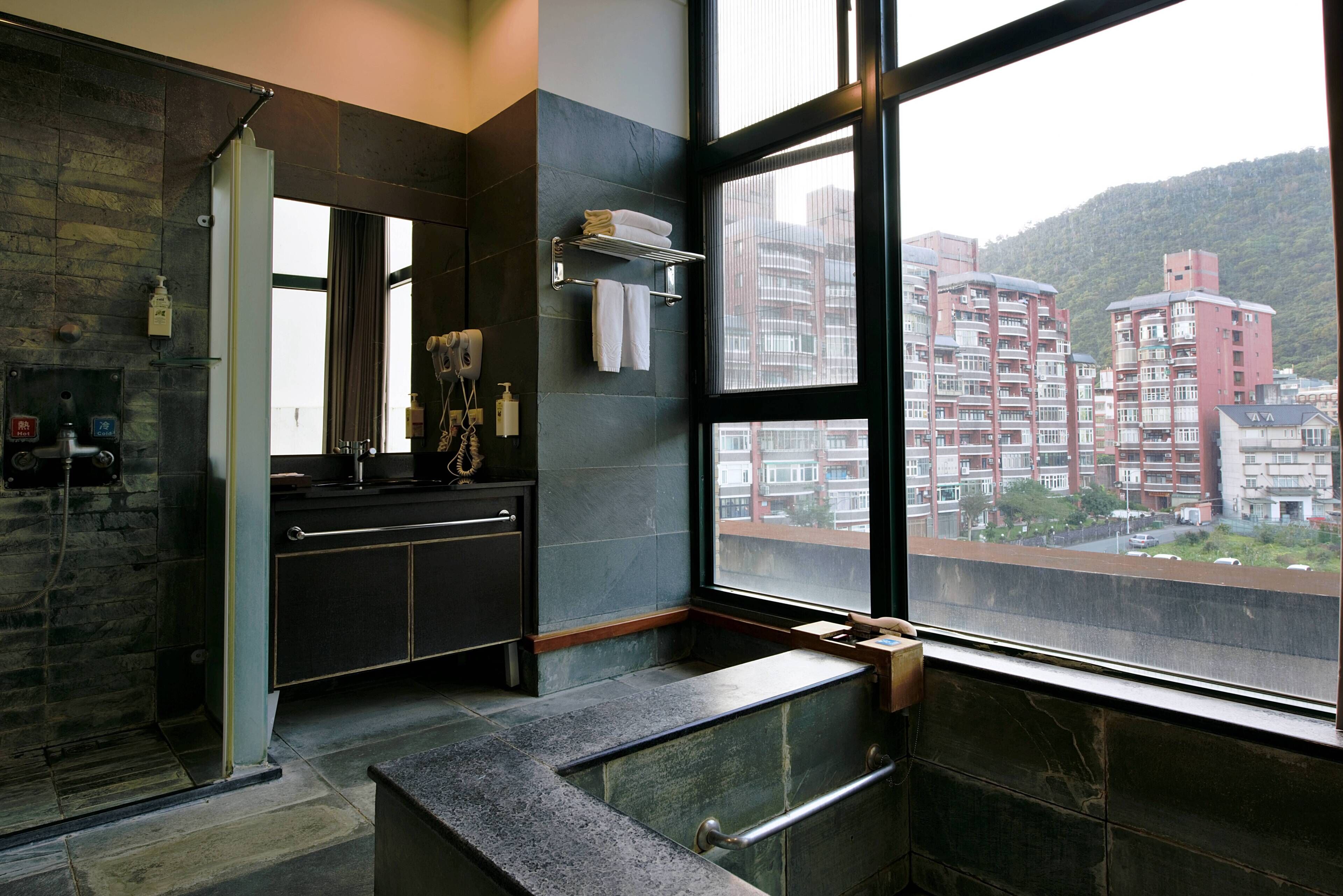 deluxe suite (offer in-room aroma diffuser and essential oil) | bathroom | separate bathtub and shower, spring water bathtub, rainfall showerhead