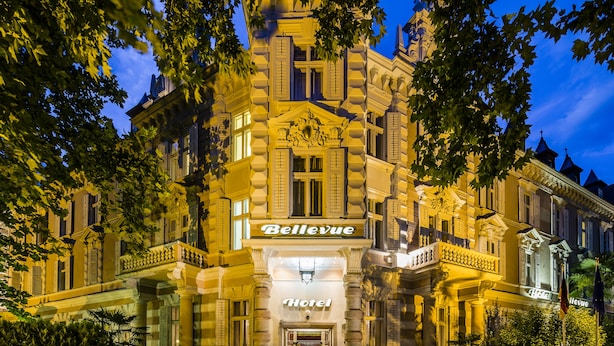 A historic hotel with a classic facade, ornate balconies, and a prominent entrance. - Grand Hotel Bellevue - adults only (Merano)