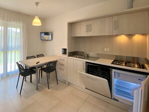 Comfort Apartment, 2 Bedrooms (Ground Floor) | Private kitchen | Full-sized fridge, microwave, stovetop, cookware/dishes/utensils
